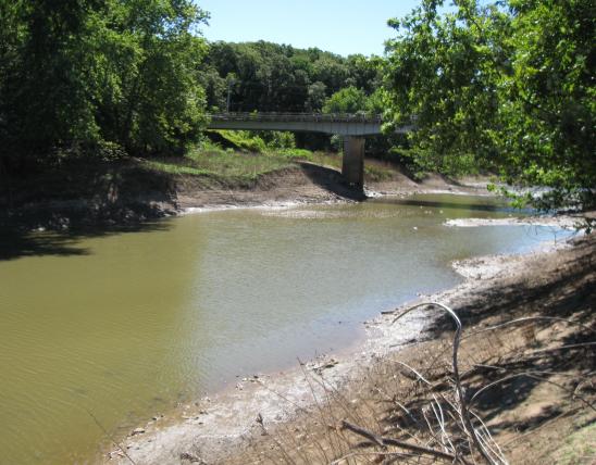 Bridge and dirt streambanks at Santa Fe Access
