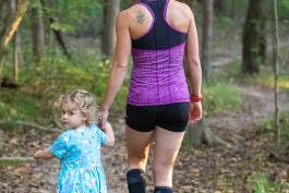 Woman and girl walking on a trail