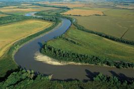 Aerial photo of a C-shaped curve in the Thompson River